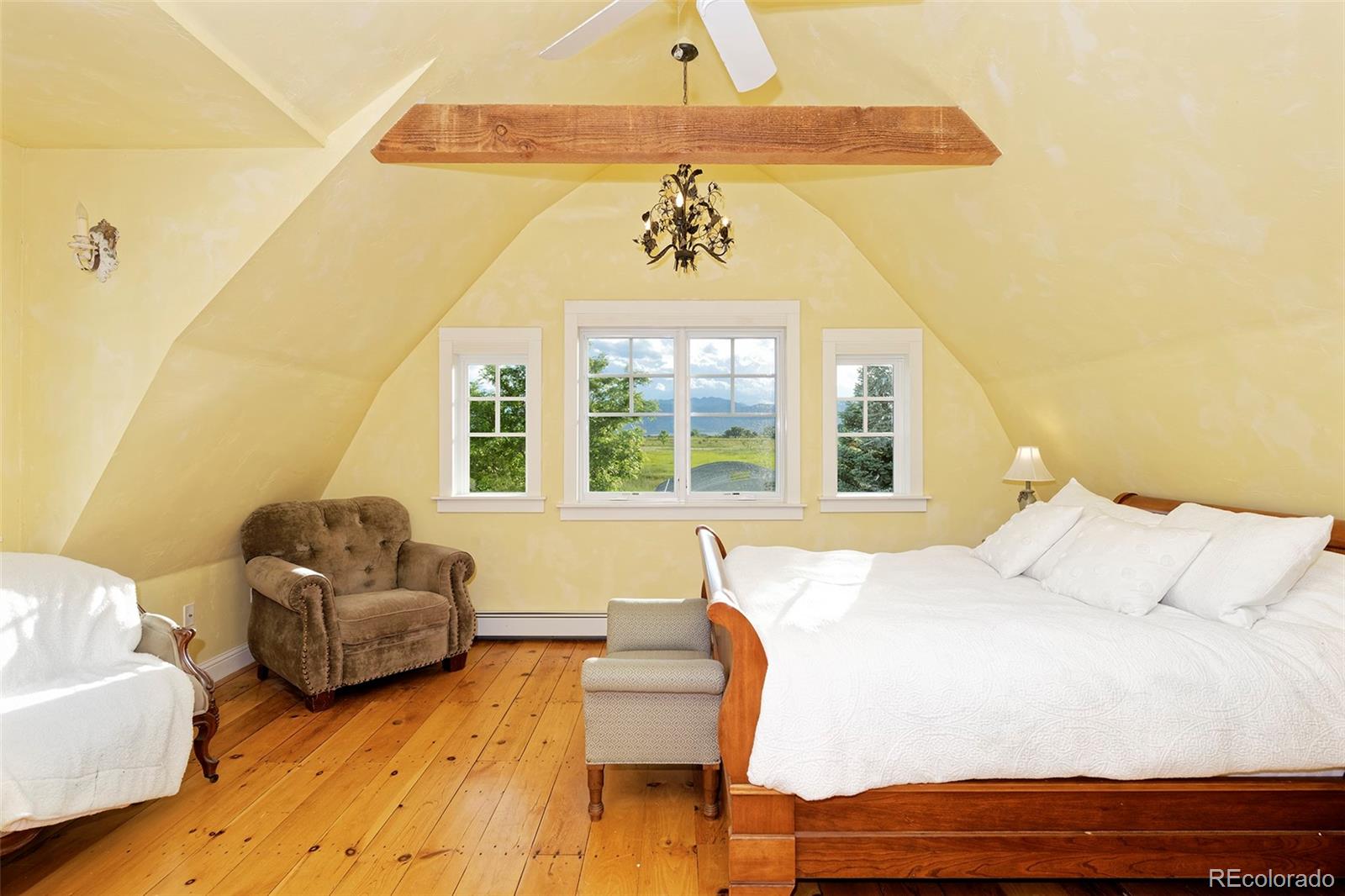 5875 Monarch Road Longmont, CO 80503 - Photo 20 of 38 a spacious bedroom with a bed and couch