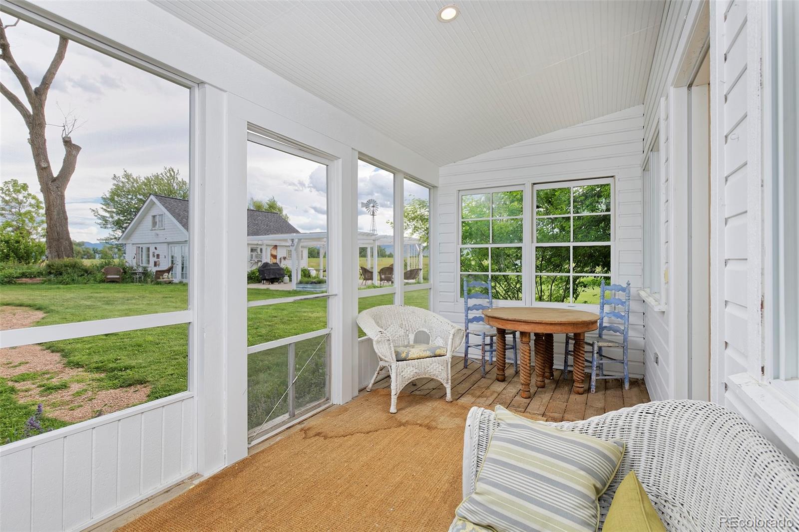 5875 Monarch Road Longmont, CO 80503 - Photo 28 of 38 a balcony with wooden furniture and garden