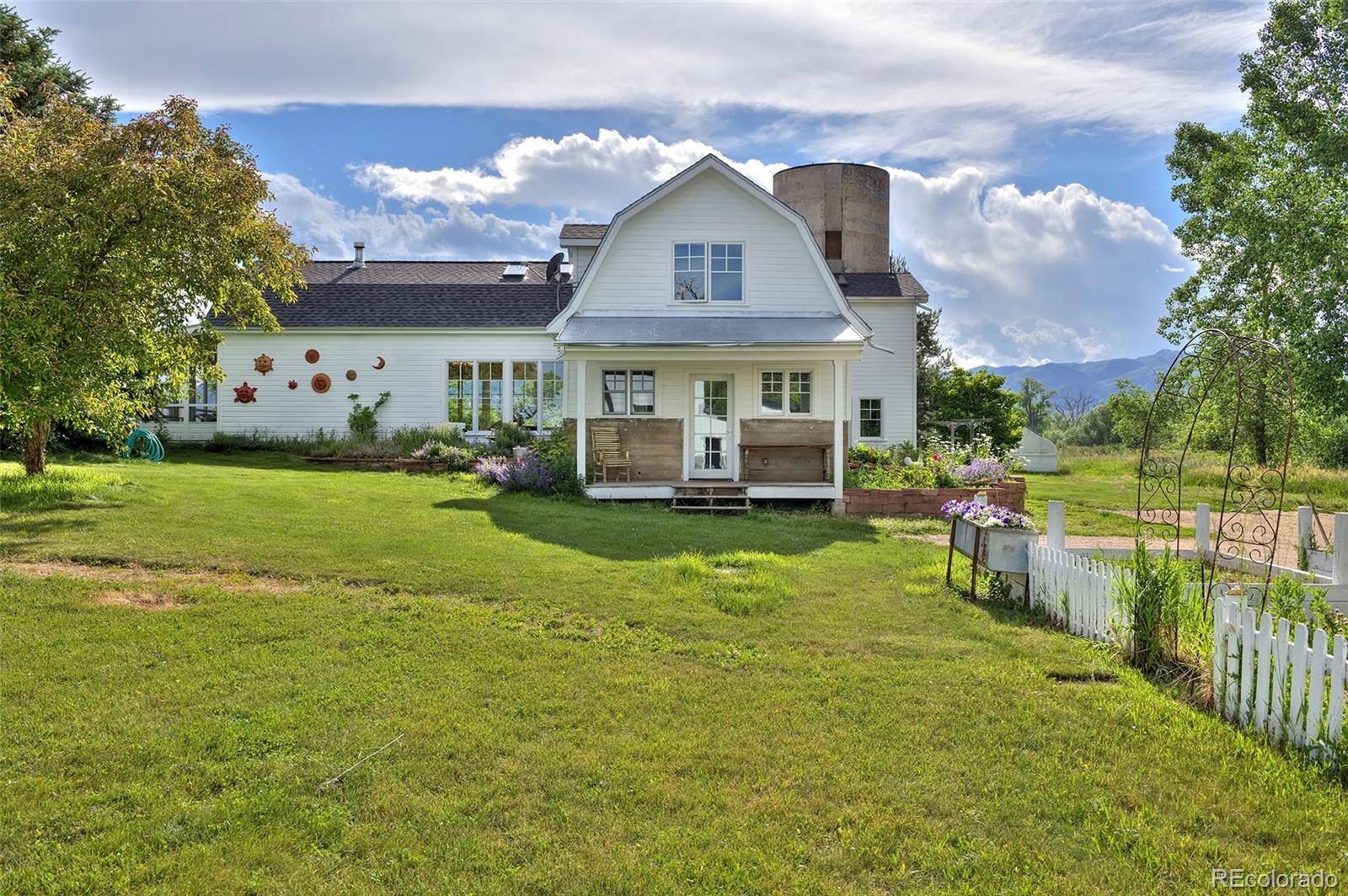 5875 Monarch Road Longmont, CO 80503 - Photo 30 of 38 a front view of house with yard and green space