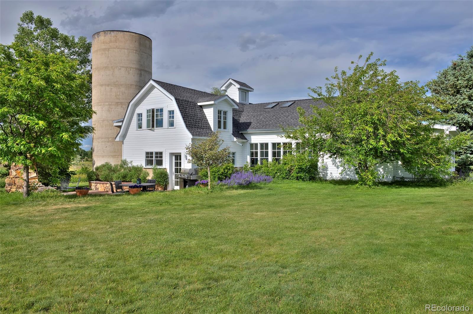 5875 Monarch Road Longmont, CO 80503 - Photo 34 of 38 a front view of a house with a yard and garage
