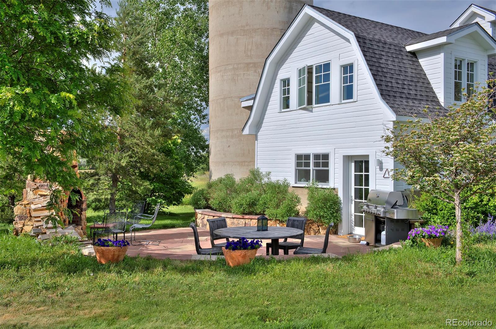 5875 Monarch Road Longmont, CO 80503 - Photo 35 of 38 a backyard of a house with table and chairs