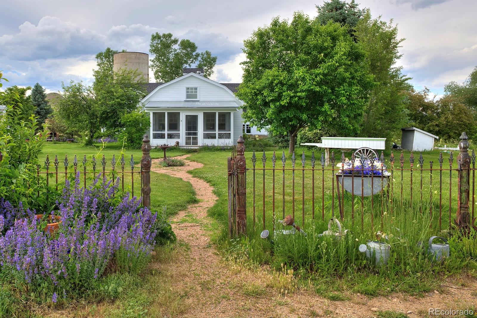 5875 Monarch Road Longmont, CO 80503 - Photo 36 of 38 a front view of a house with a garden