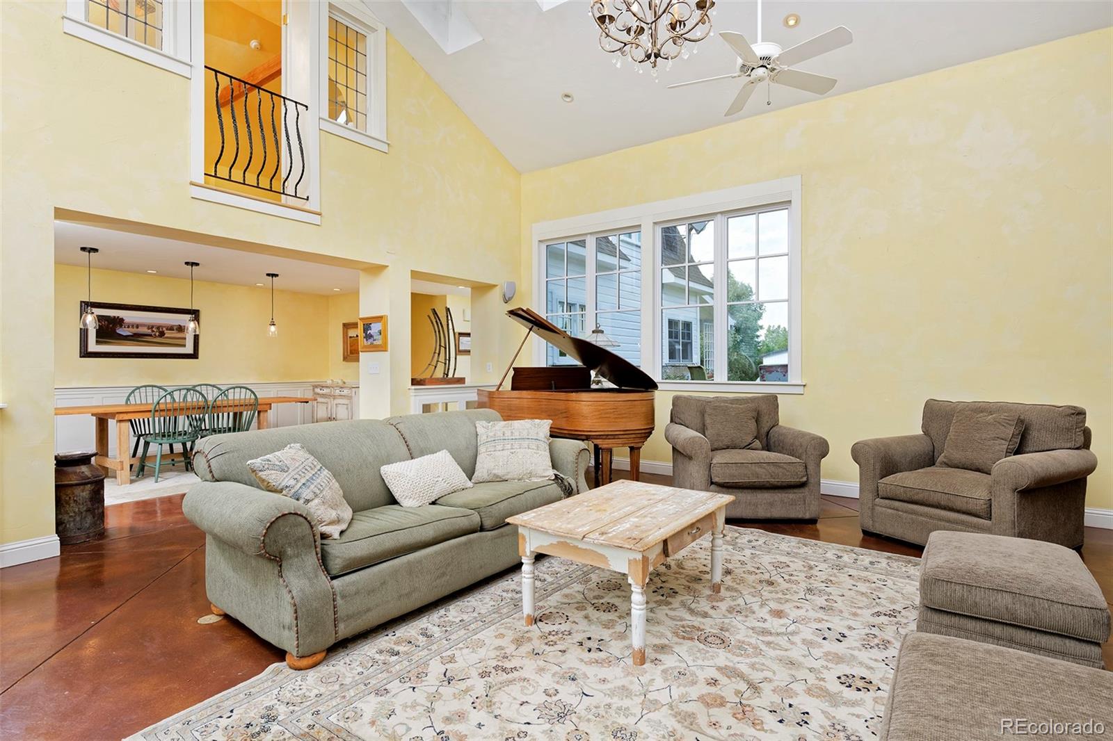 5875 Monarch Road Longmont, CO 80503 - Photo 10 of 38 a living room with furniture wooden floor and a large window