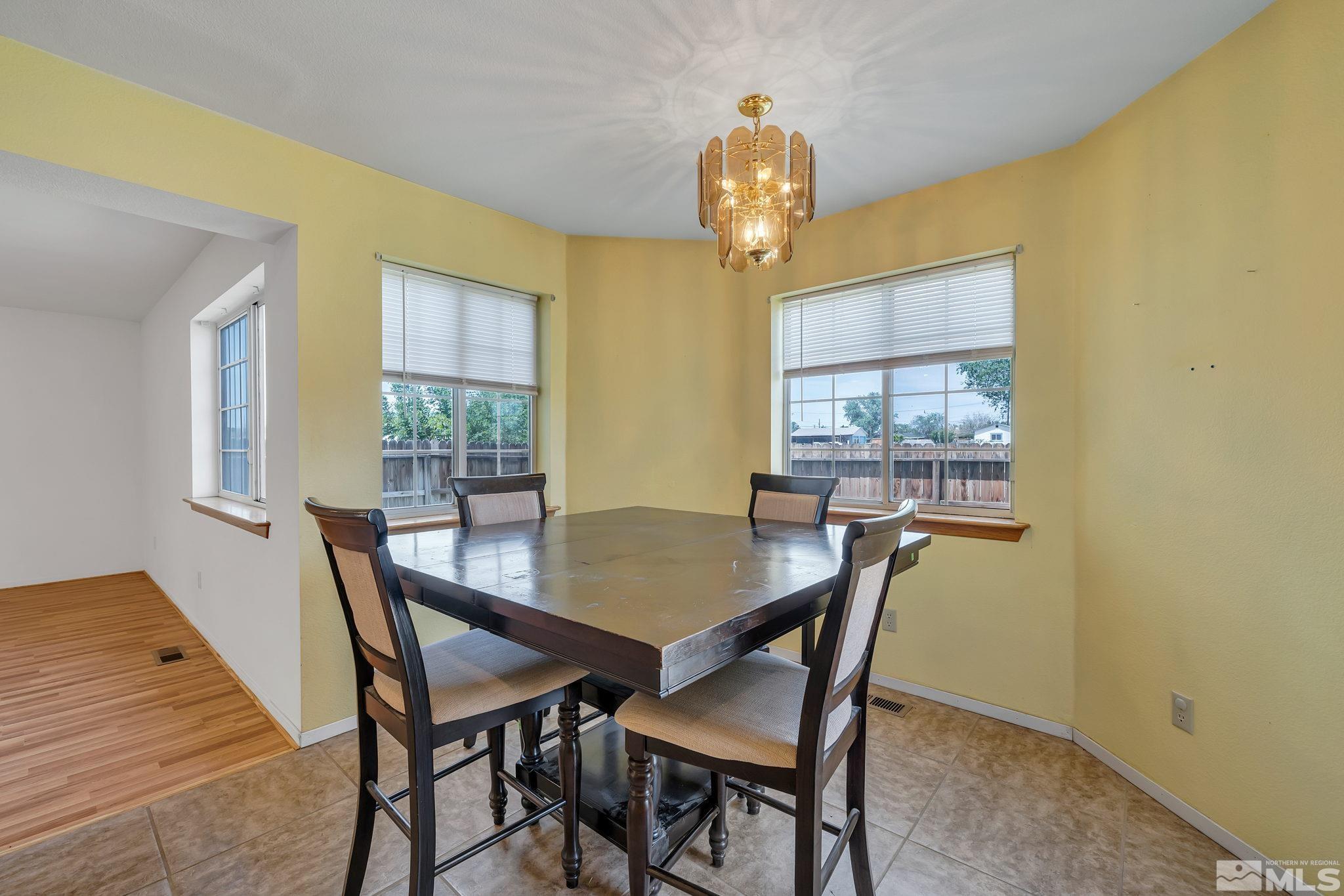 610 Sunset Drive Fallon, NV 89406 - Photo 12 of 36 a view of a dining room that has a table and chairs in it