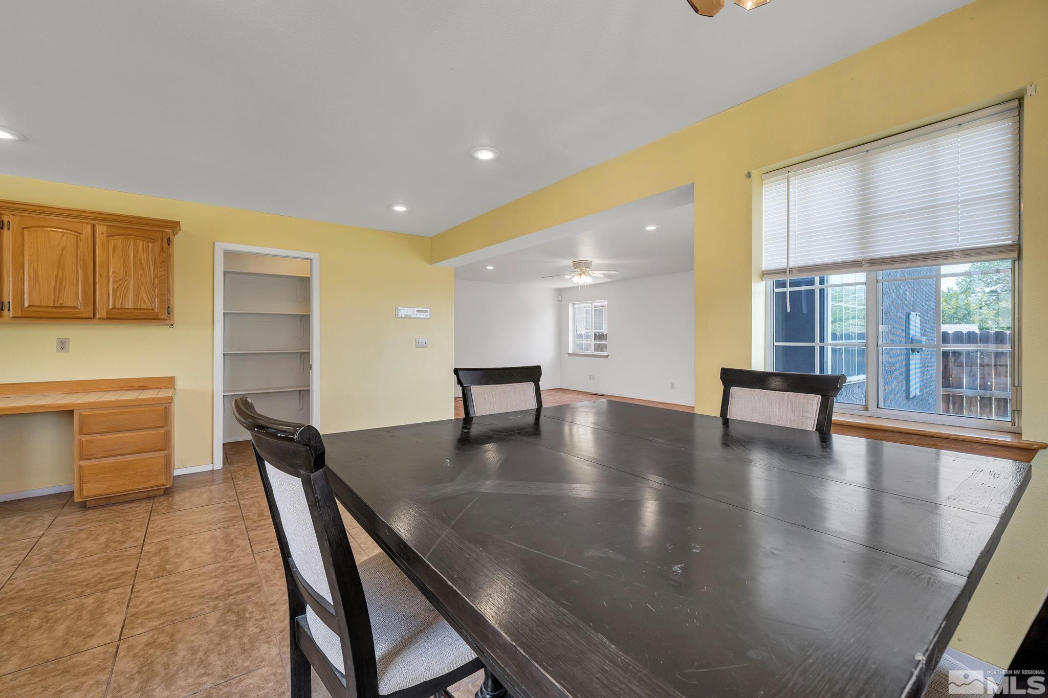 610 Sunset Drive Fallon, NV 89406 - Photo 15 of 36 a dining room with furniture and wooden floor