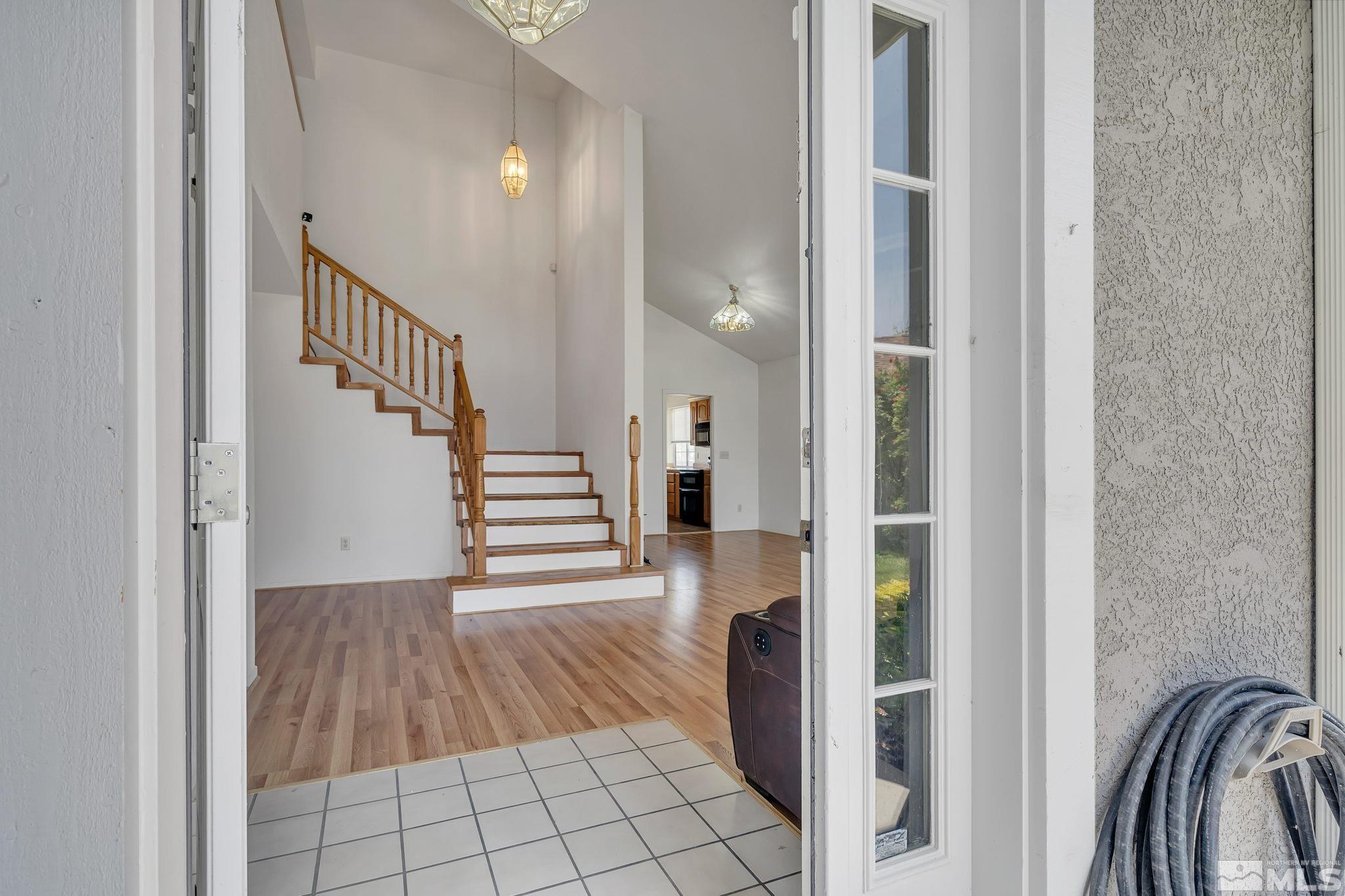 610 Sunset Drive Fallon, NV 89406 - Photo 2 of 36 a view of a hallway with wooden floor and staircase