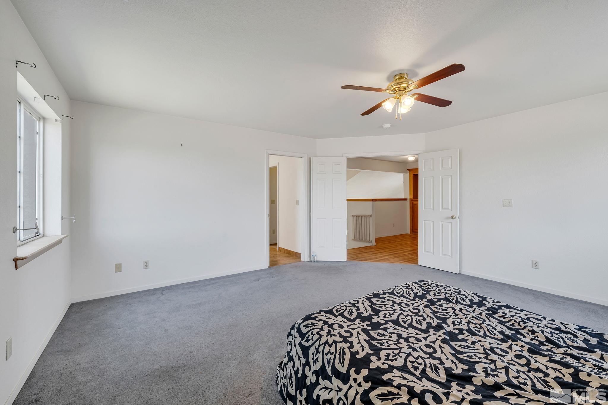 610 Sunset Drive Fallon, NV 89406 - Photo 22 of 36 a bedroom with a bed and a window
