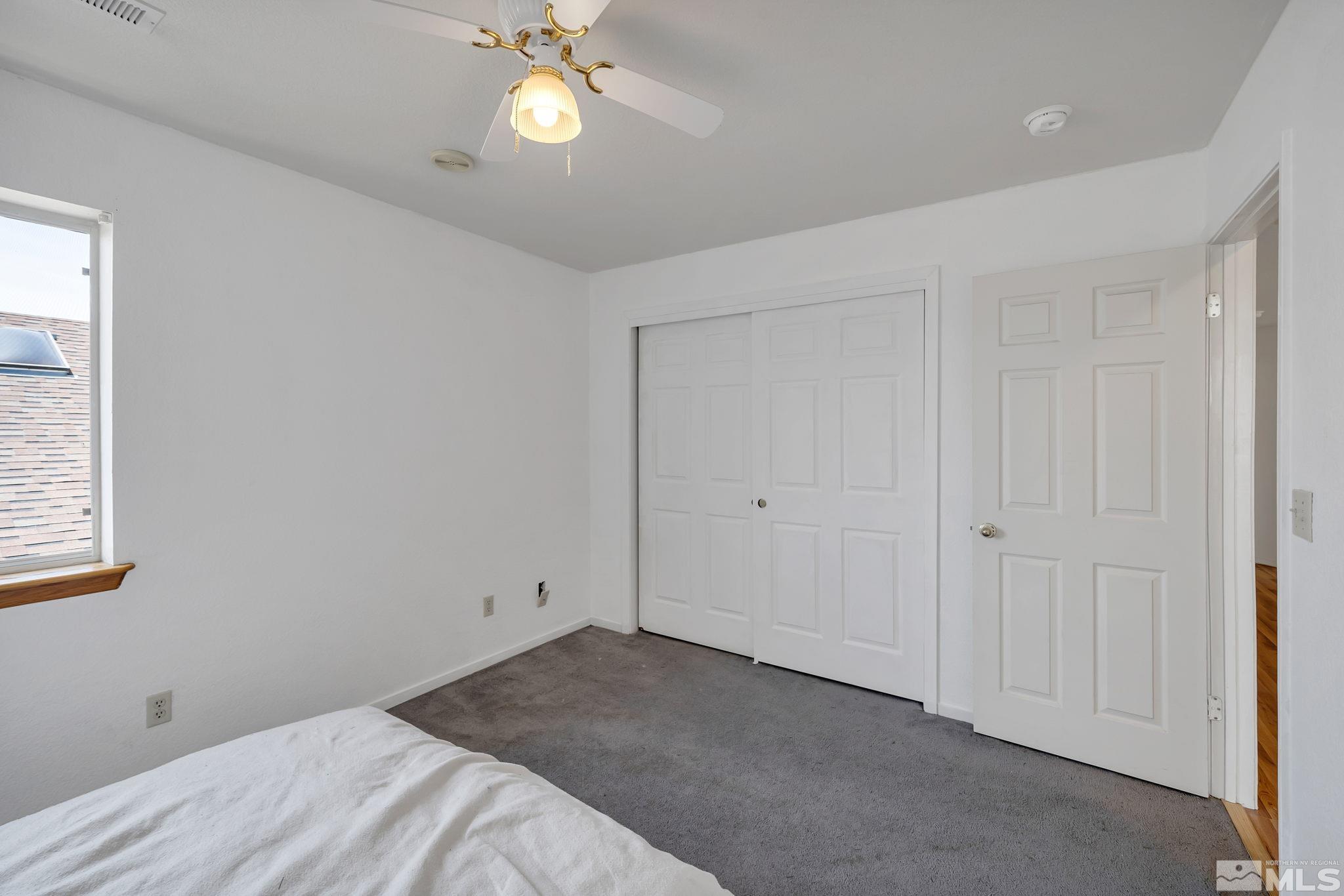 610 Sunset Drive Fallon, NV 89406 - Photo 29 of 36 a view of a room with wooden floor and ceiling fan