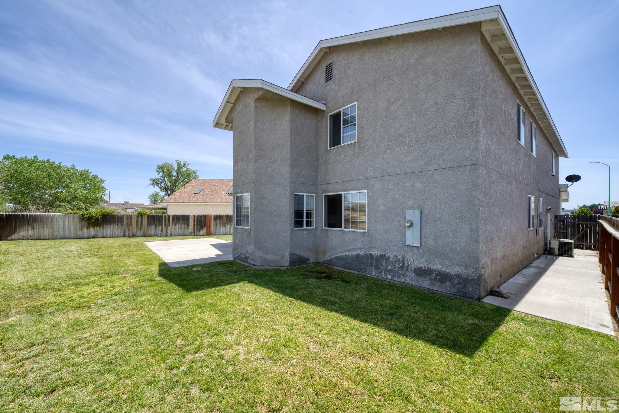 610 Sunset Drive Fallon, NV 89406 - Photo 34 of 36 a front view of a house with a yard