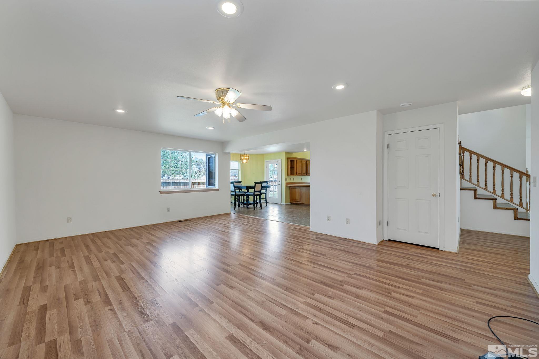 610 Sunset Drive Fallon, NV 89406 - Photo 7 of 36 a view of an empty room with wooden floor and a window