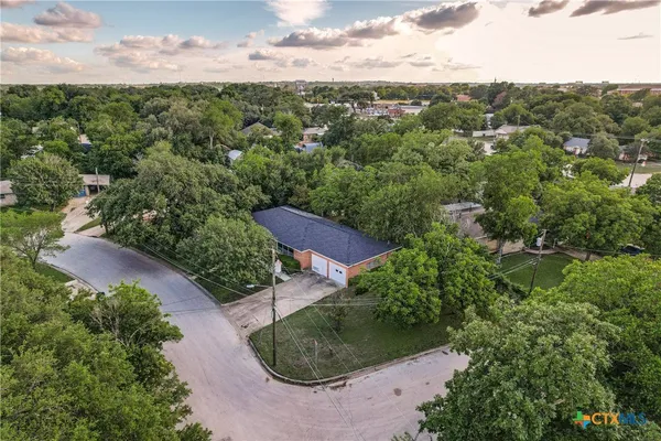 an aerial view of a house with mountain view