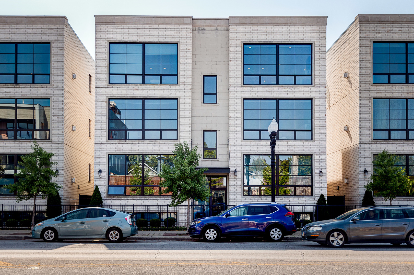 2453 West Irving Park Road, Unit 3W Chicago, IL 60618 - Photo 1 of 15 a car parked in front of a building