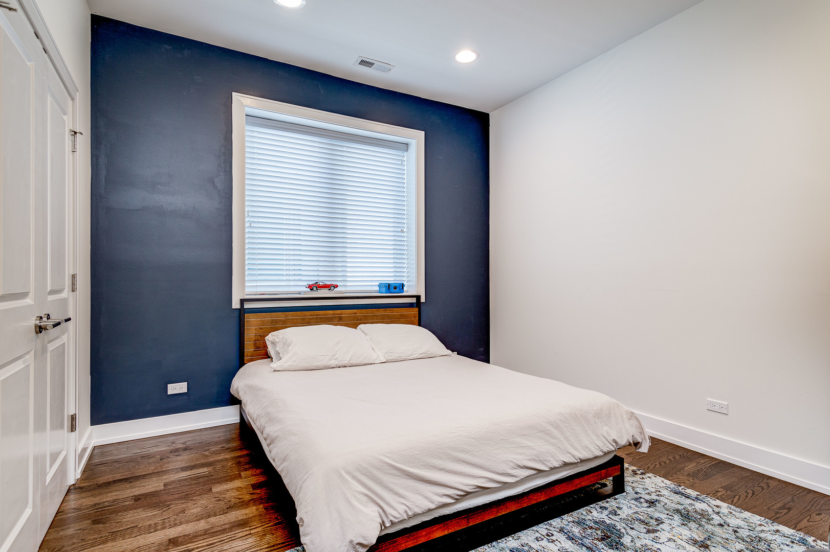 2453 West Irving Park Road, Unit 3W Chicago, IL 60618 - Photo 11 of 15 a bedroom with a bed and a window