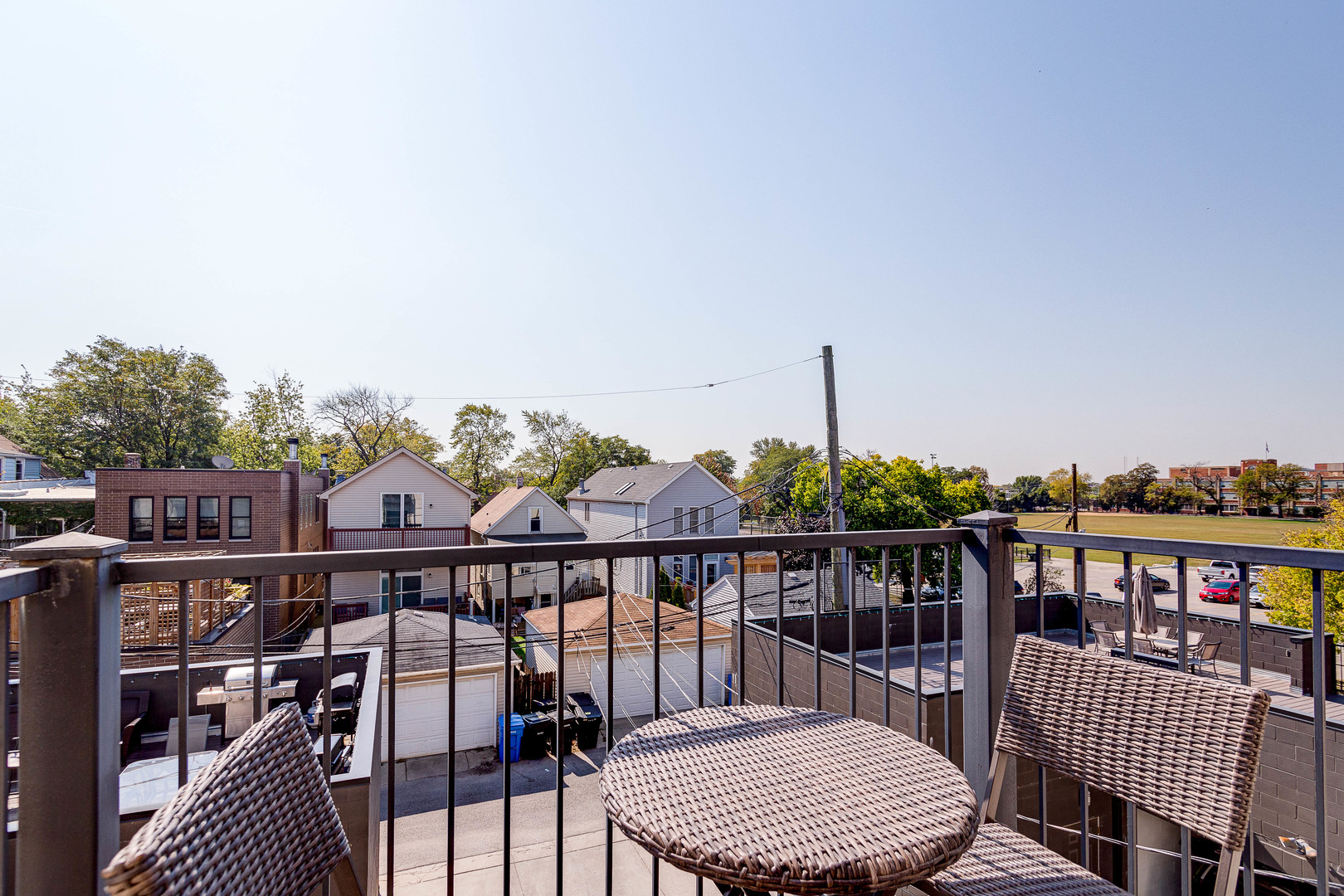 2453 West Irving Park Road, Unit 3W Chicago, IL 60618 - Photo 14 of 15 a view of a balcony with outdoor seating