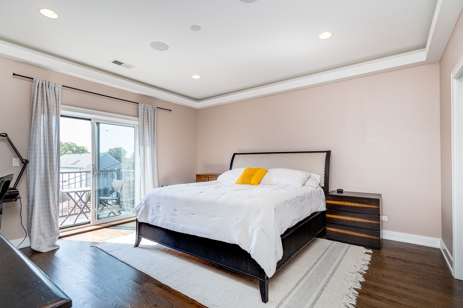 2453 West Irving Park Road, Unit 3W Chicago, IL 60618 - Photo 7 of 15 a bedroom with a bed and wooden floor