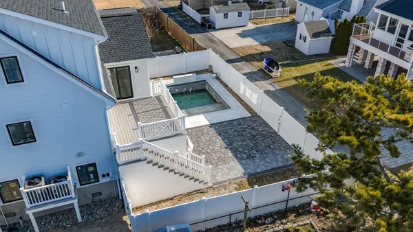 a view of balcony with wooden floor