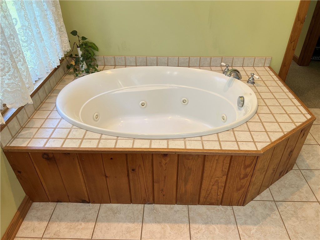 1419 Mill Creek Road Wake, VA 23176 - Photo 32 of 49 Bathroom with light tile patterned floors and a jetted tub