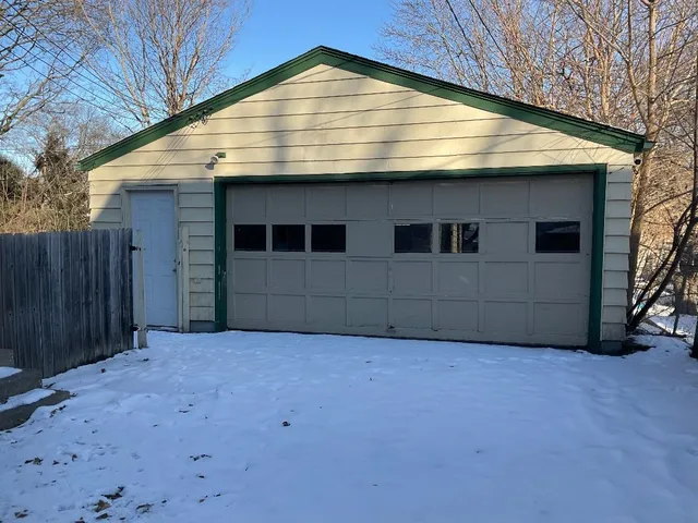 a view of an house with a backyard