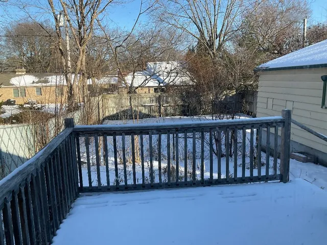a view of a balcony with trees