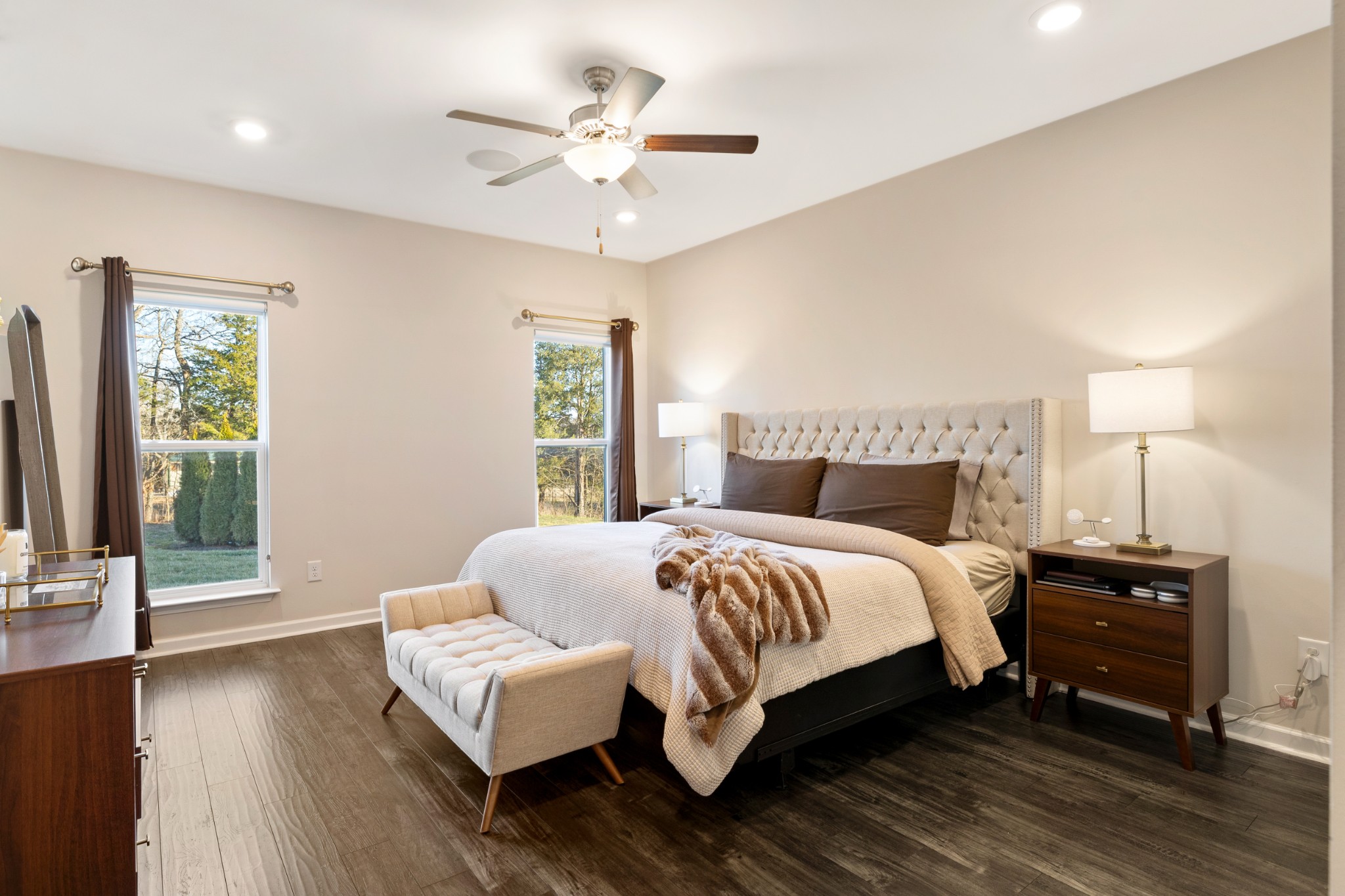 633 Castle Road Mount Juliet, TN 37122 - Photo 11 of 30 a bedroom with a large bed and a chandelier