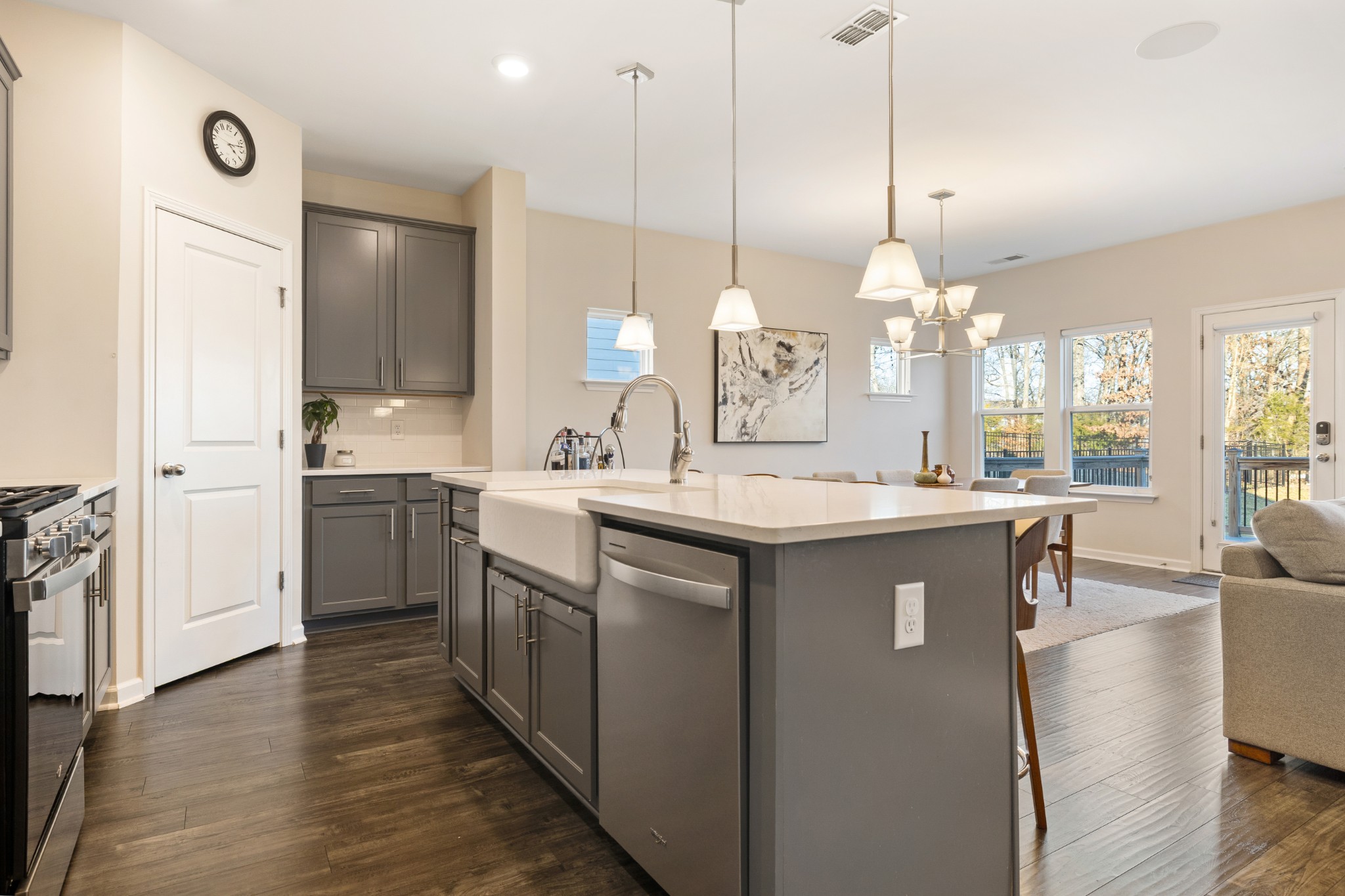 633 Castle Road Mount Juliet, TN 37122 - Photo 5 of 30 a kitchen with kitchen island a sink a stove and a wooden floor