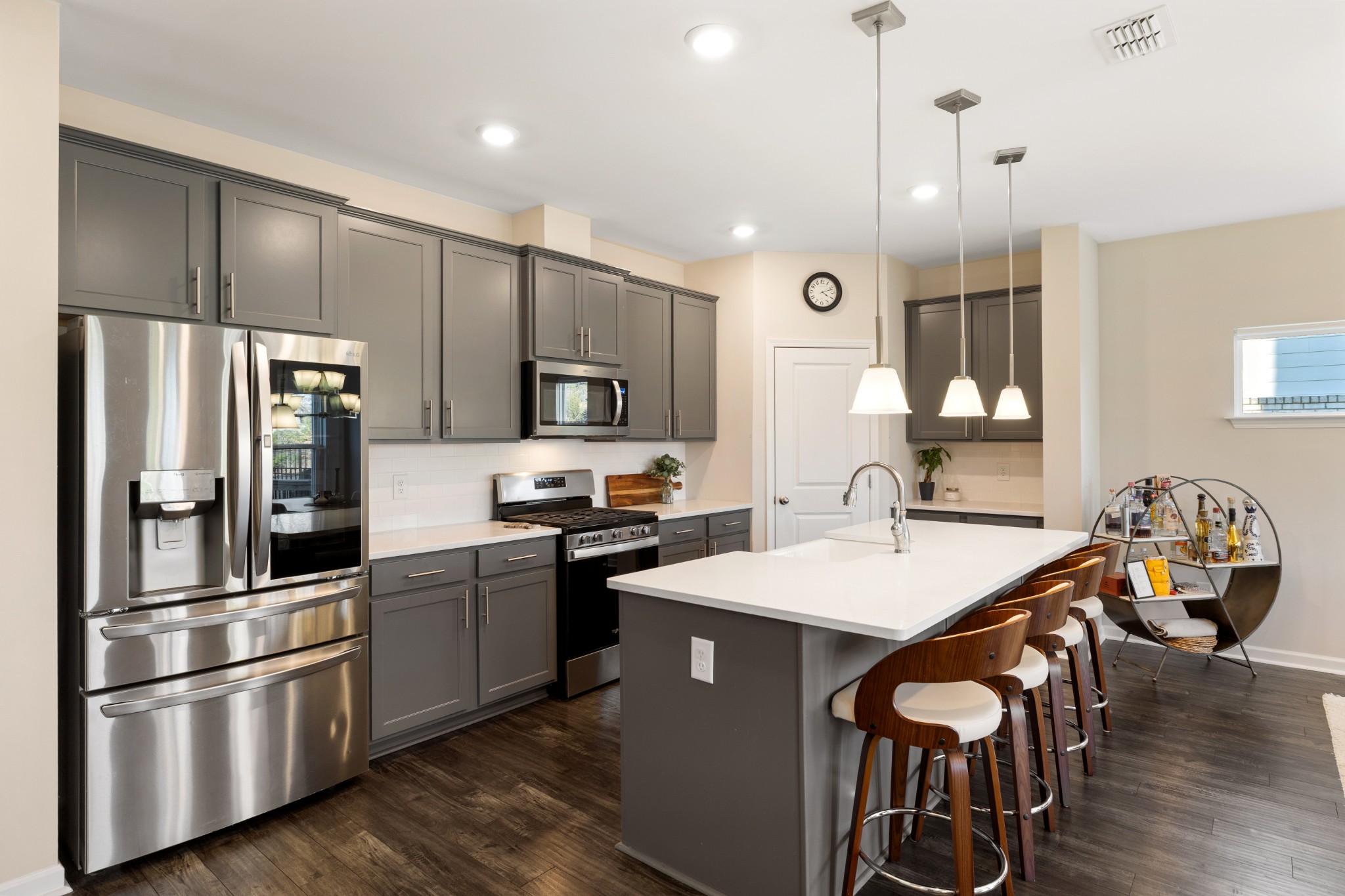633 Castle Road Mount Juliet, TN 37122 - Photo 9 of 30 a kitchen with stainless steel appliances granite countertop a refrigerator a sink dishwasher a stove and a refrigerator with wooden floor
