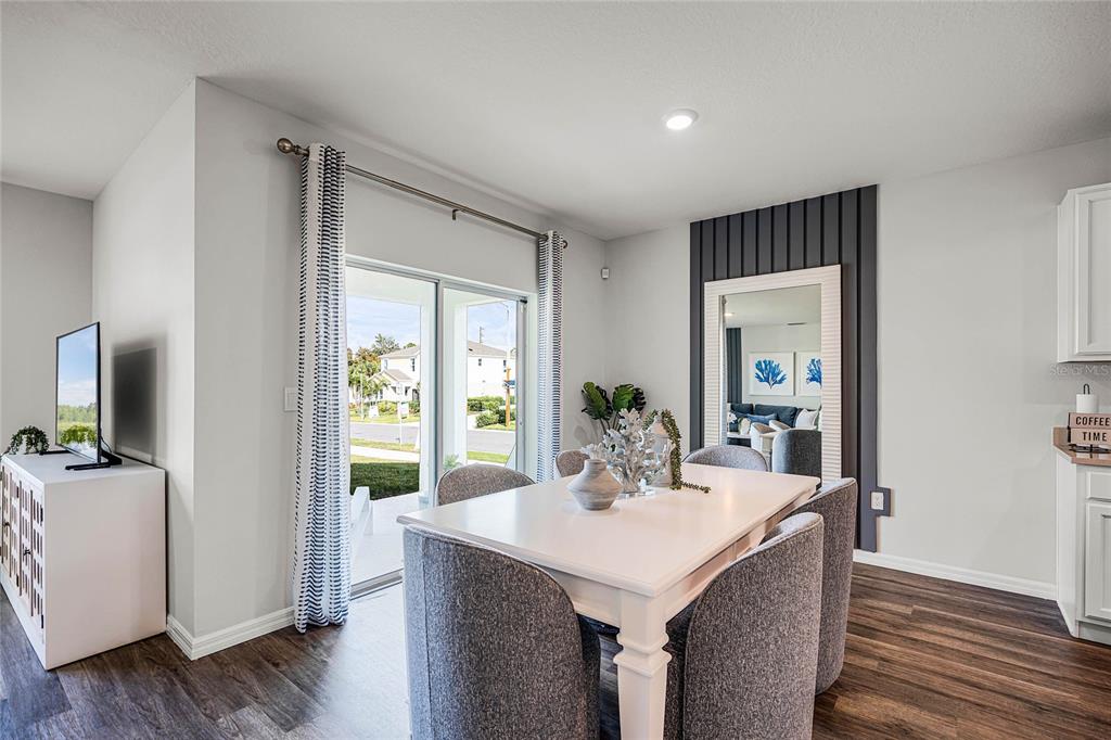 3514 Roden Road Haines City, FL 33844 - Photo 15 of 35 a view of a dining room with furniture window and wooden floor
