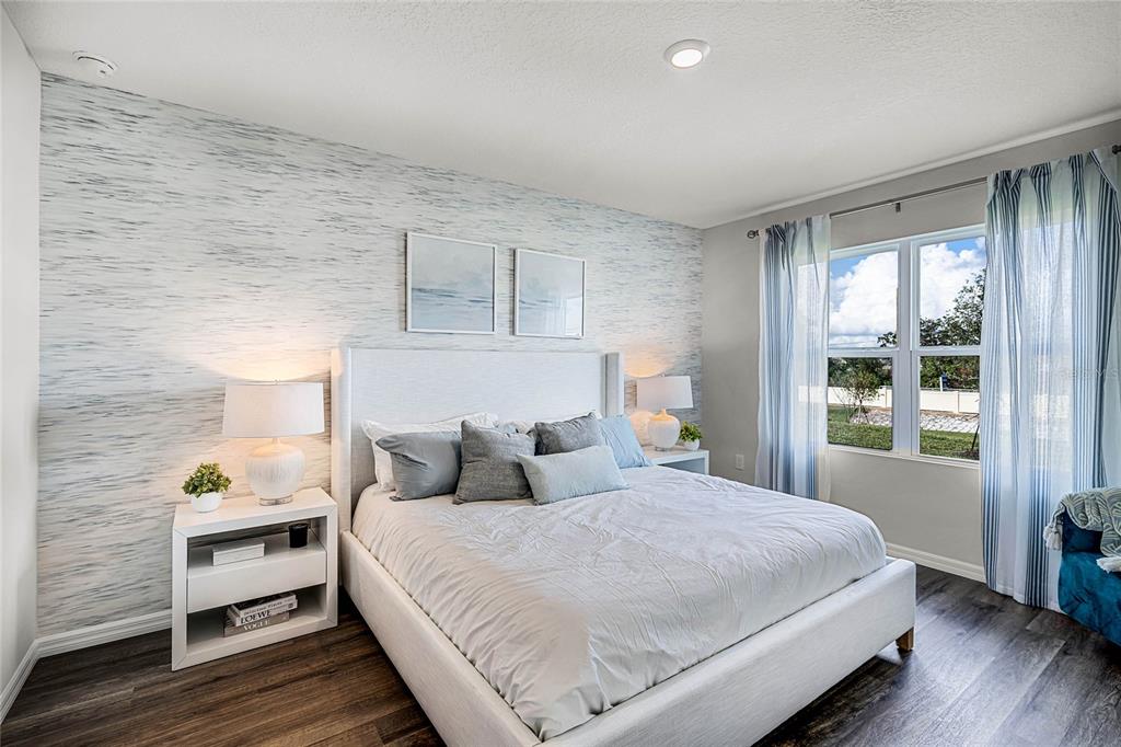 3514 Roden Road Haines City, FL 33844 - Photo 16 of 35 a bedroom with a bed and wooden floor