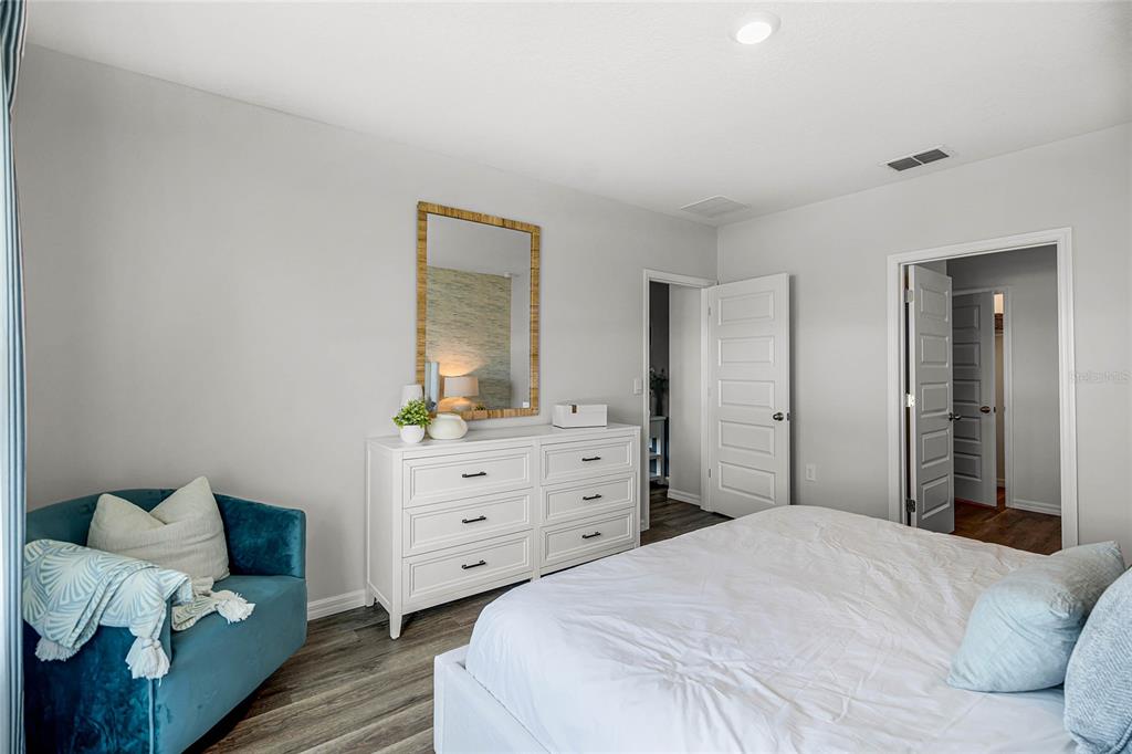 3514 Roden Road Haines City, FL 33844 - Photo 17 of 35 a bedroom with a bed and a dresser