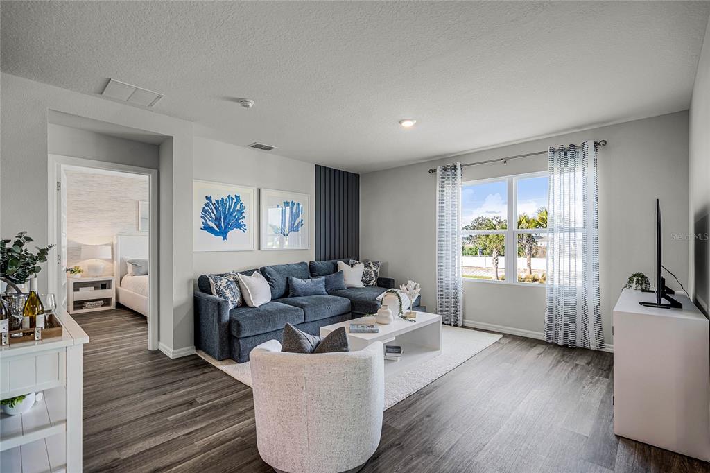 3514 Roden Road Haines City, FL 33844 - Photo 2 of 35 a living room with furniture large window and wooden floor