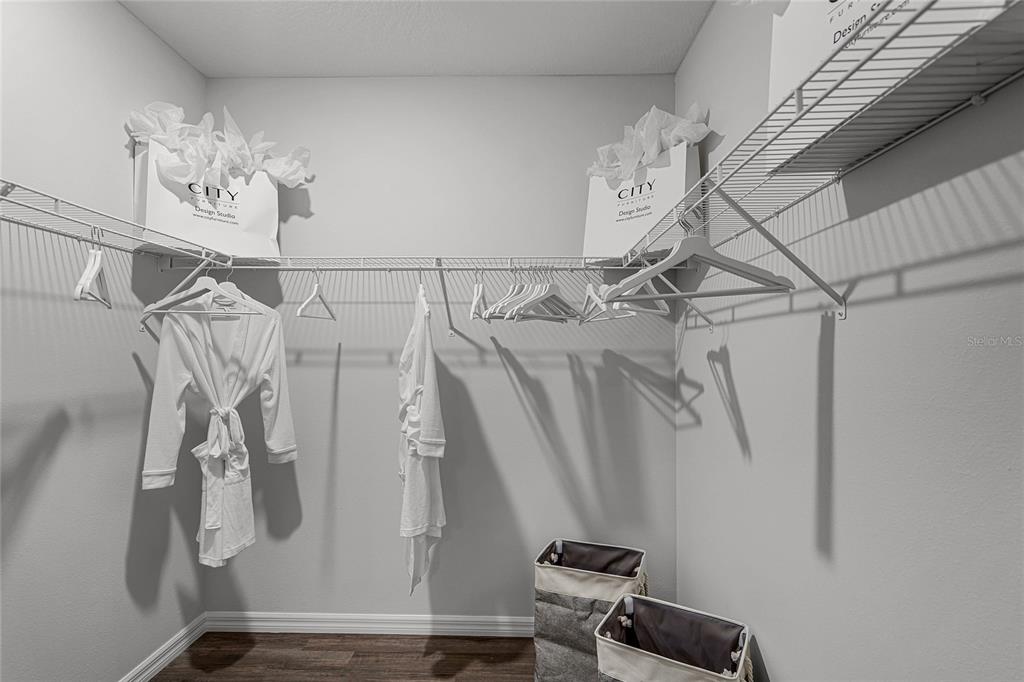 3514 Roden Road Haines City, FL 33844 - Photo 25 of 35 a view of walk in closet with clothes and shoes