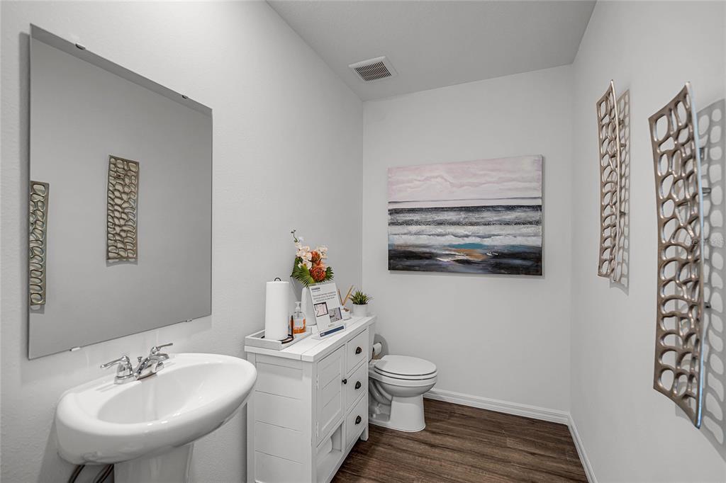 3514 Roden Road Haines City, FL 33844 - Photo 30 of 35 a bathroom with a sink toilet and a mirror