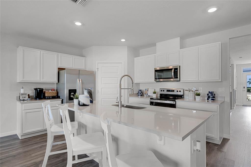 3514 Roden Road Haines City, FL 33844 - Photo 6 of 35 a kitchen with granite countertop a sink and appliances