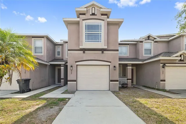 a kitchen with a sink a refrigerator and a stove top oven