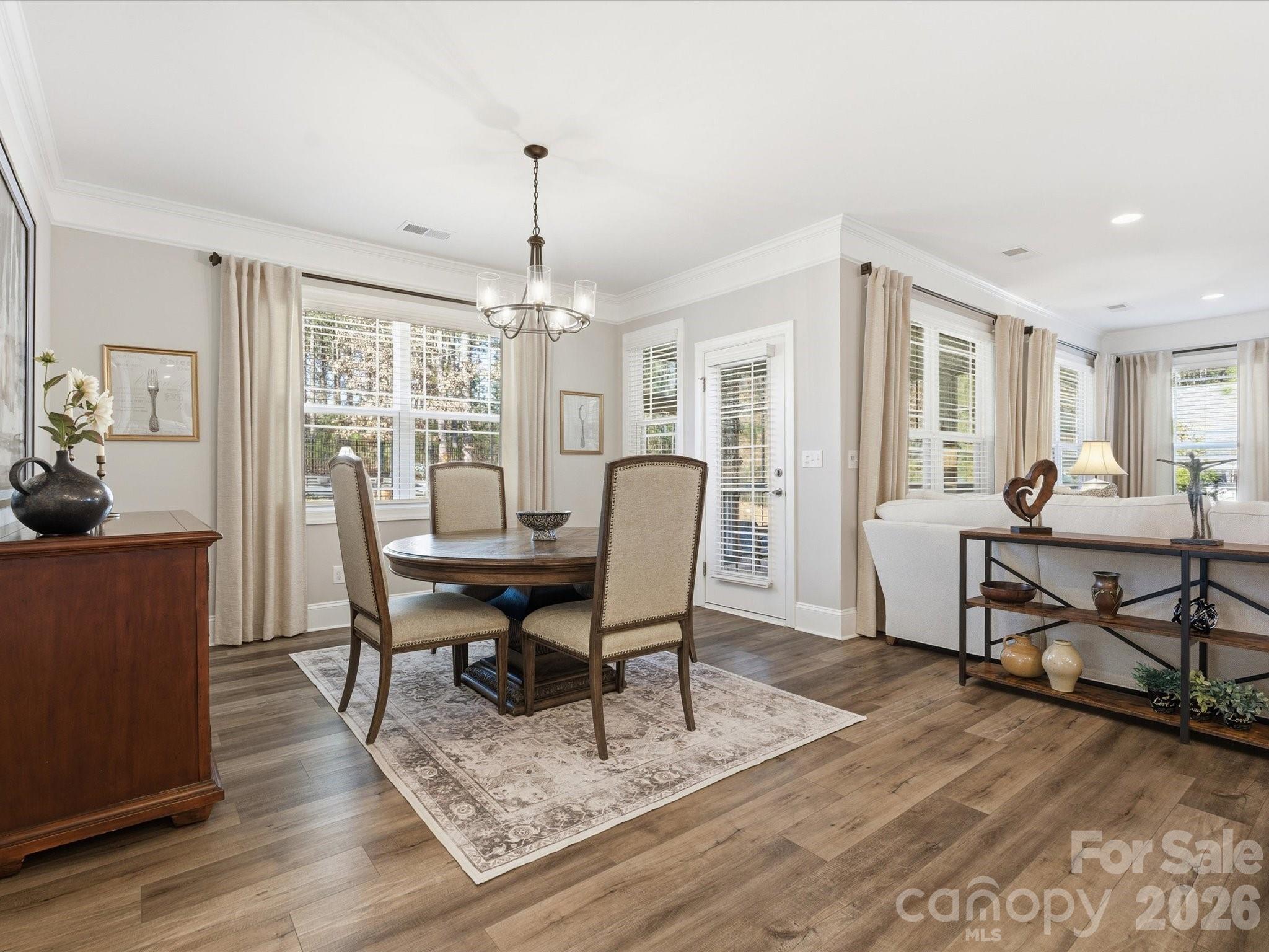 4166 Persimmon Road Lancaster, SC 29720 - Photo 17 of 41 a view of a dining room with furniture window and wooden floor