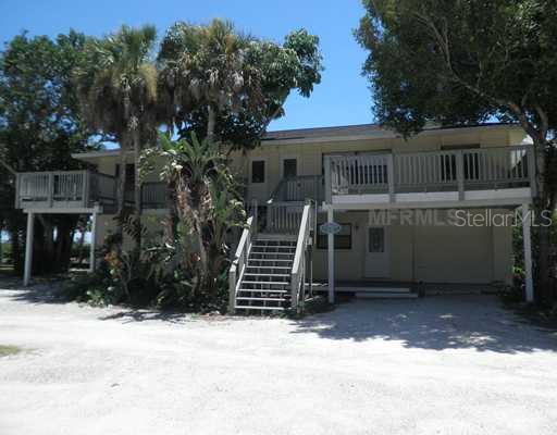 5039 North Beach Road Englewood, FL 34223 - Photo 1 of 1 a front view of house with yard