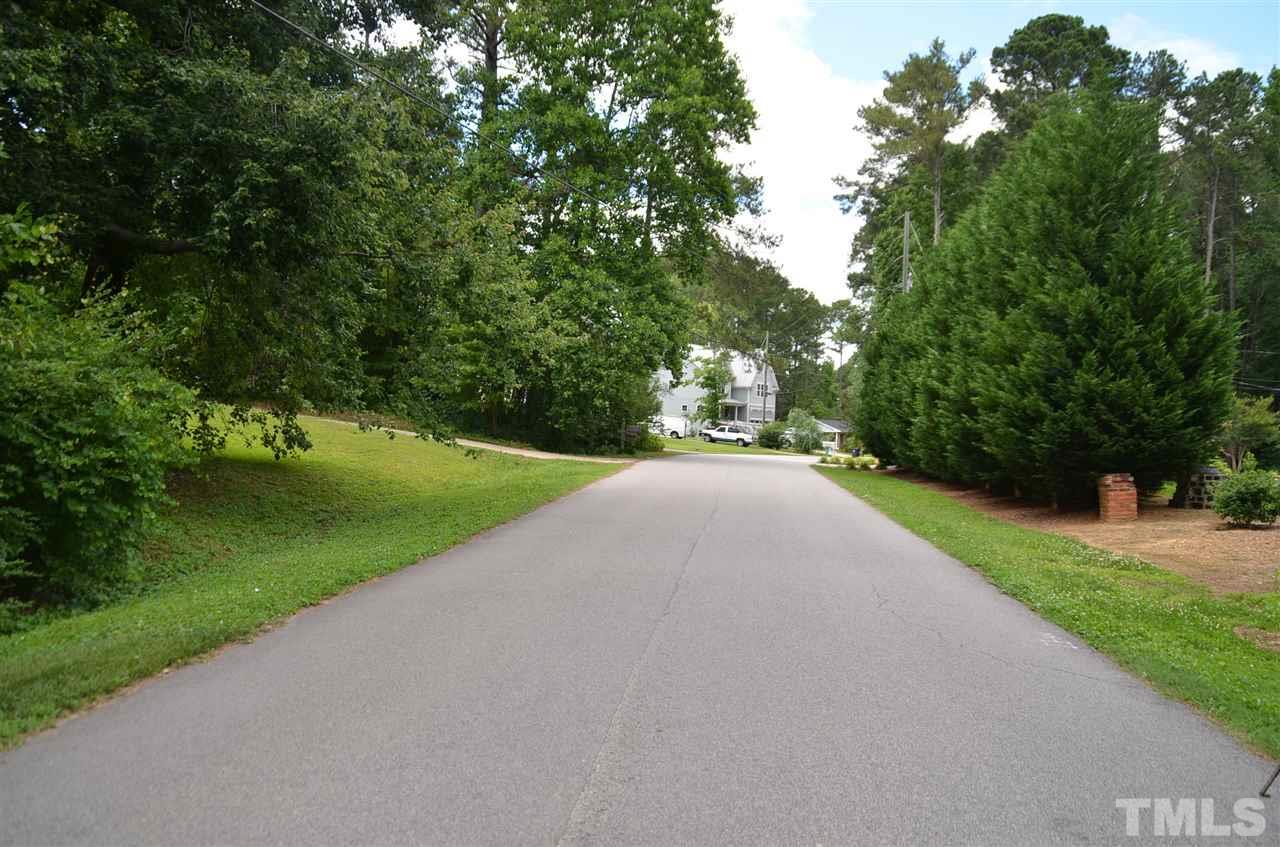 5321 Olive Road Raleigh, NC 27606 - Photo 3 of 4 a view of a road with a yard