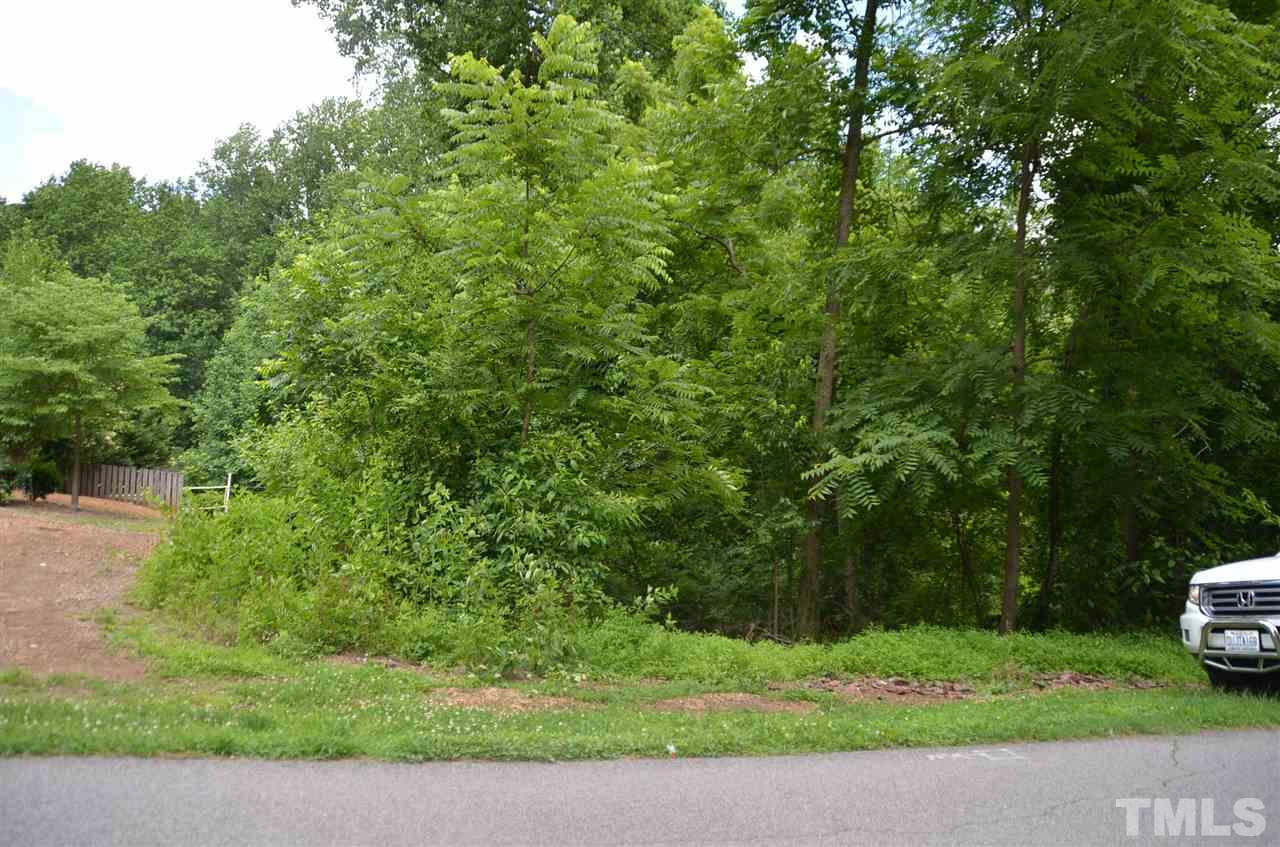 5321 Olive Road Raleigh, NC 27606 - Photo 4 of 4 a view of a yard with a house in the background