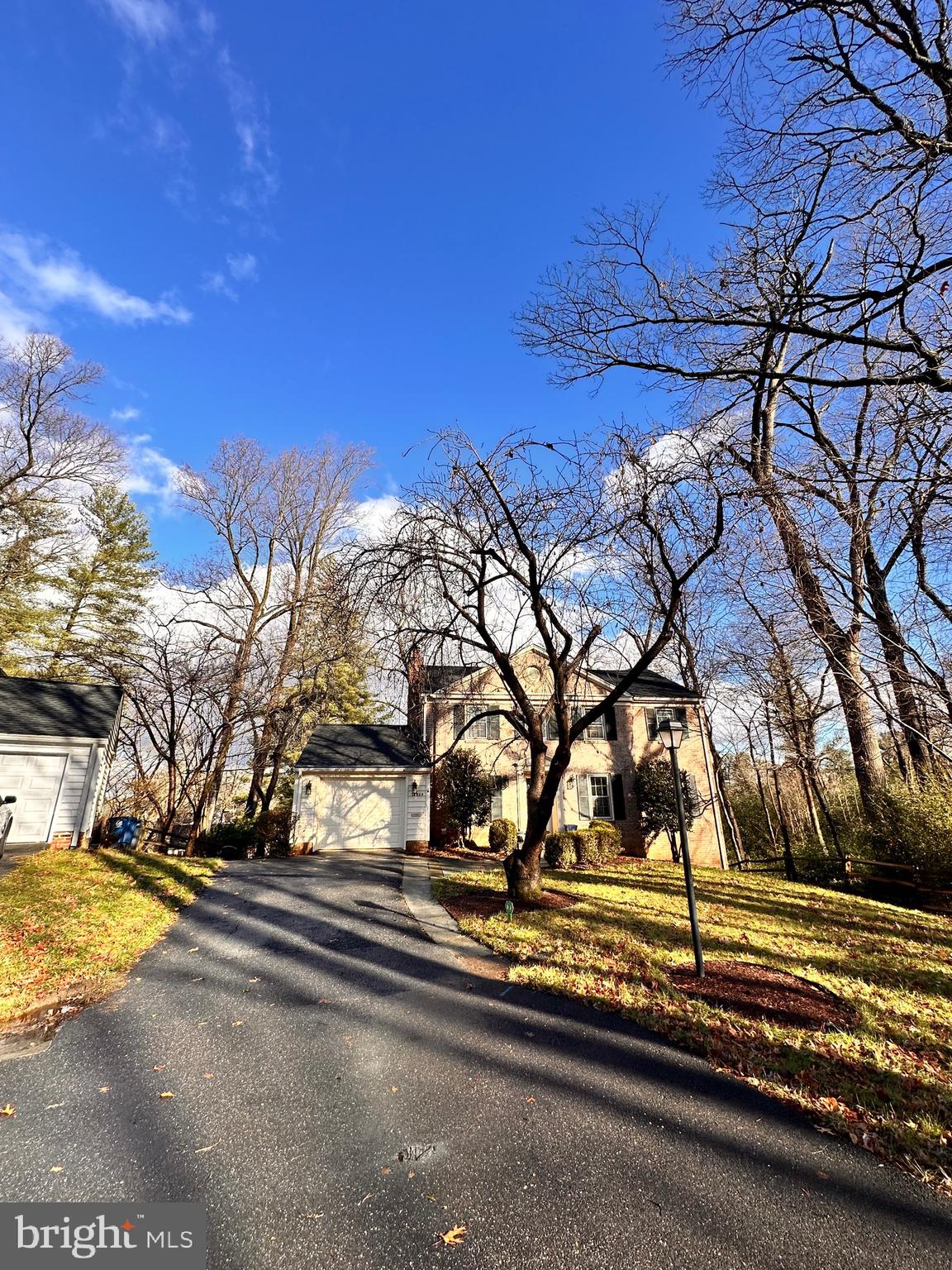 a view of a yard with yellow house