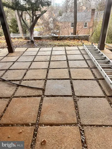 a room with kitchen island a stove a sink dishwasher and a refrigerator with wooden floor