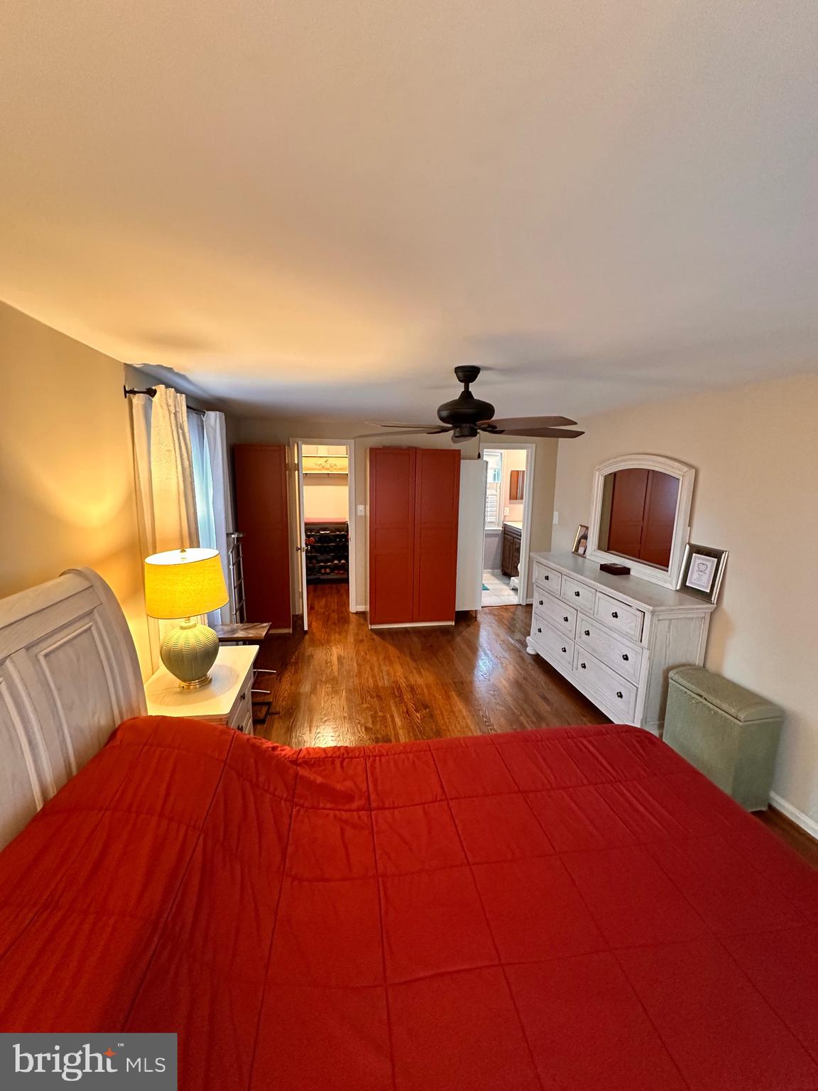 18929 Diary Road Gaithersburg, MD 20886 - Photo 38 of 52 a bedroom with a bed and wooden floor