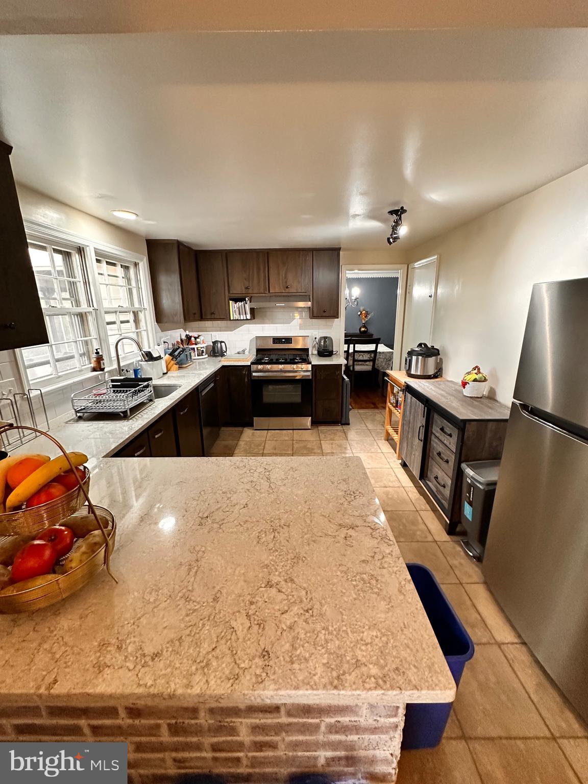 18929 Diary Road Gaithersburg, MD 20886 - Photo 8 of 52 a kitchen with sink refrigerator and cabinets
