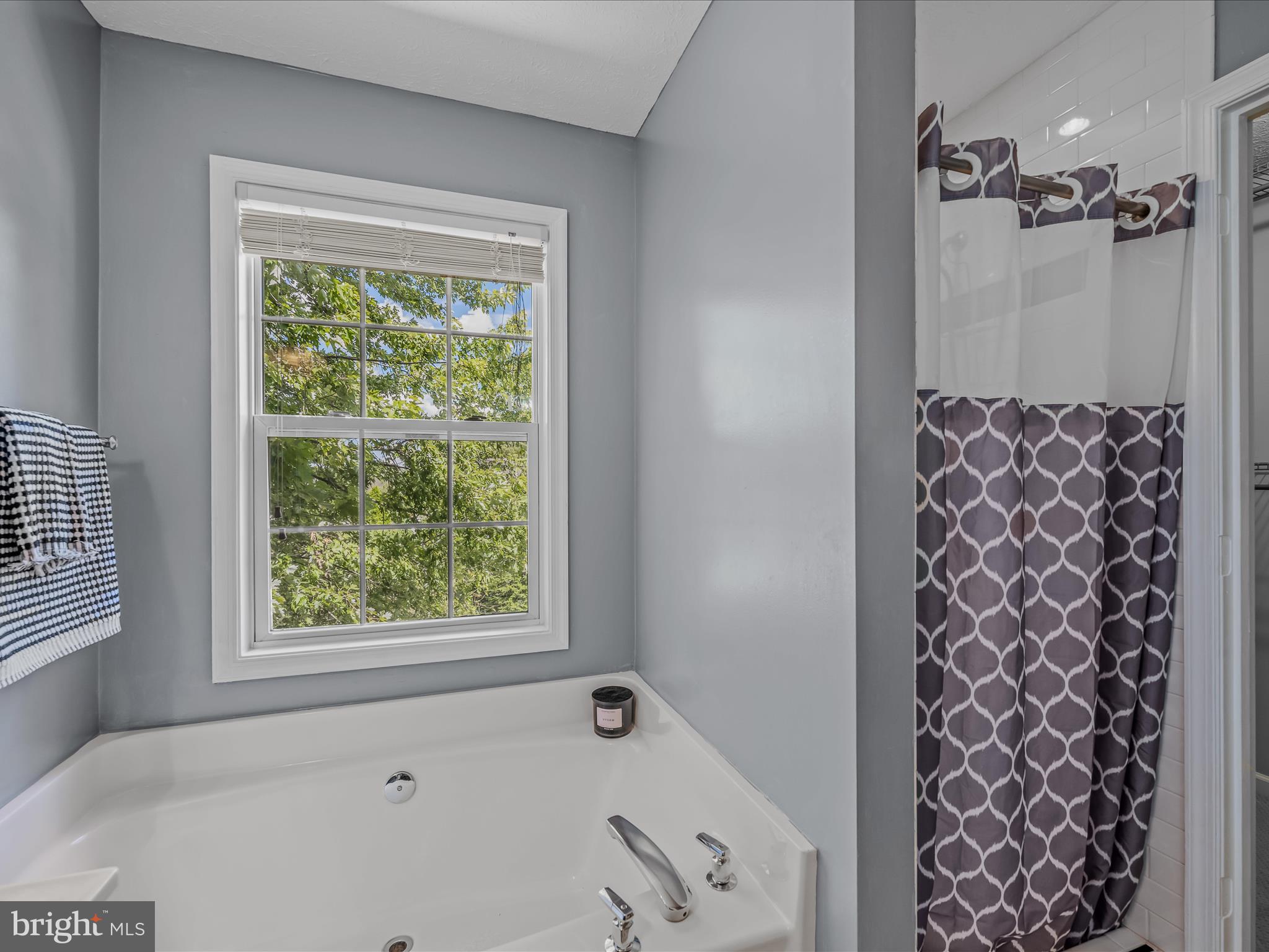 571 Oak Lee Drive Ranson, WV 25438 - Photo 13 of 45 a bathroom with a bathtub and shower