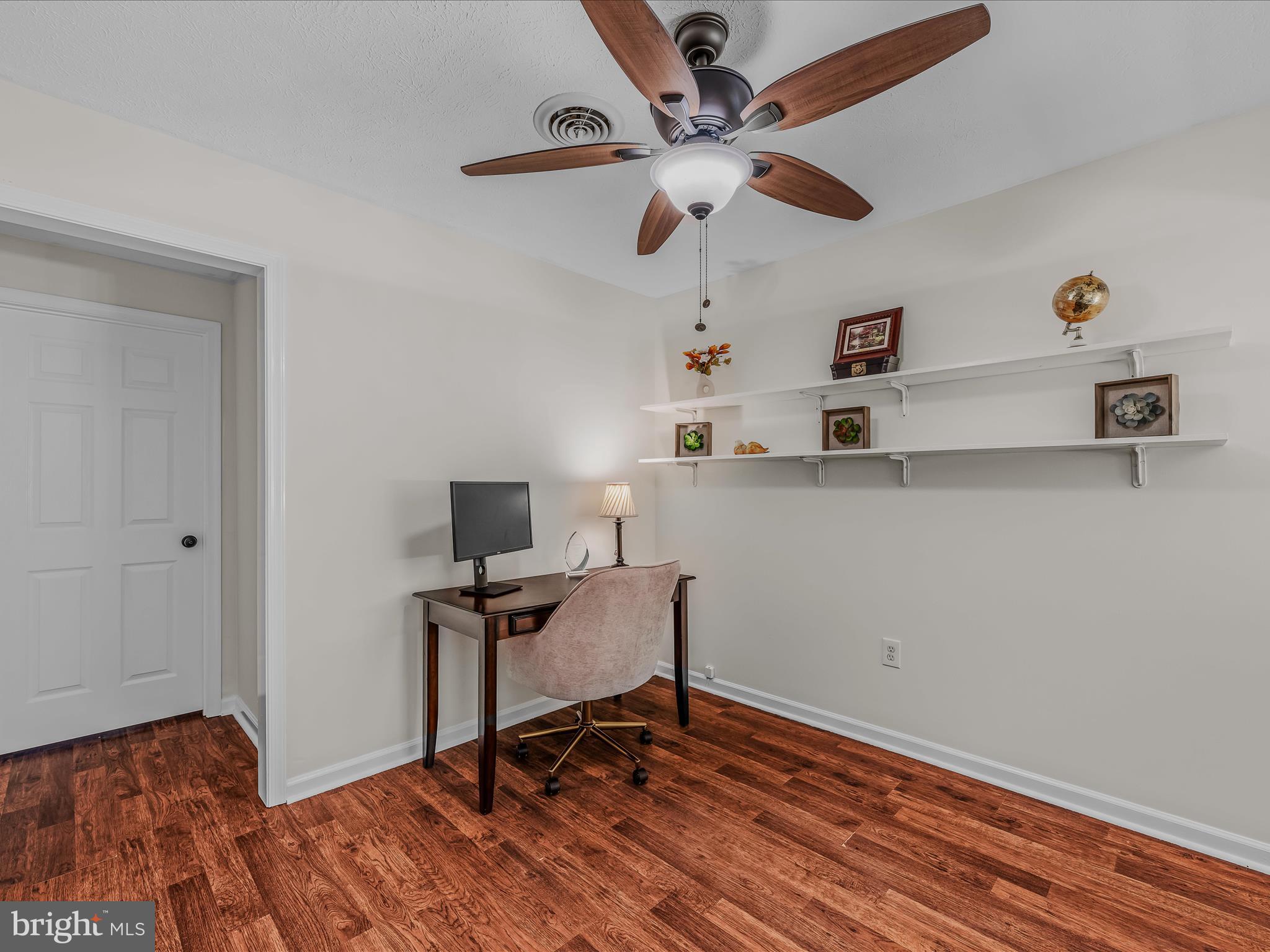 571 Oak Lee Drive Ranson, WV 25438 - Photo 23 of 45 a view of a workspace with furniture and wooden floor