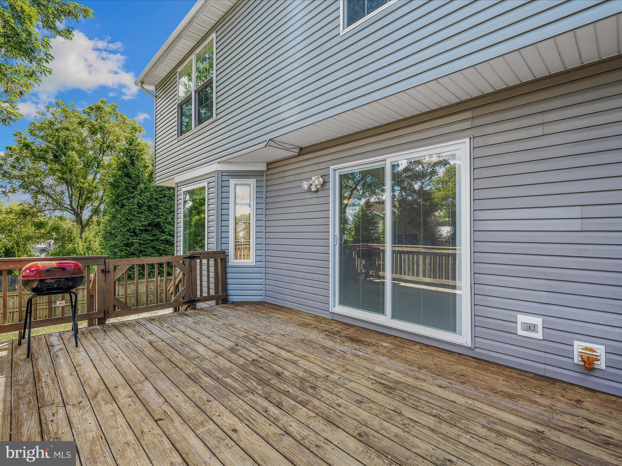 571 Oak Lee Drive Ranson, WV 25438 - Photo 26 of 45 a view of a deck with wooden floor and fence next to a yard