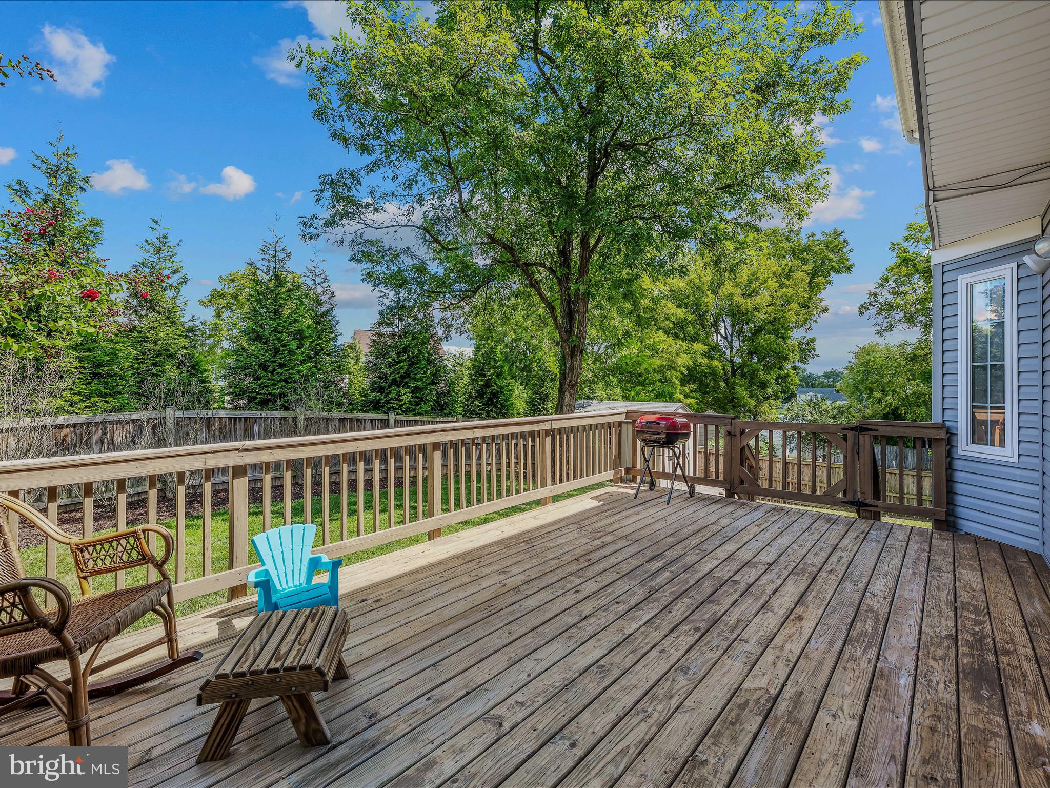 571 Oak Lee Drive Ranson, WV 25438 - Photo 27 of 45 a view of a wooden deck with a bench