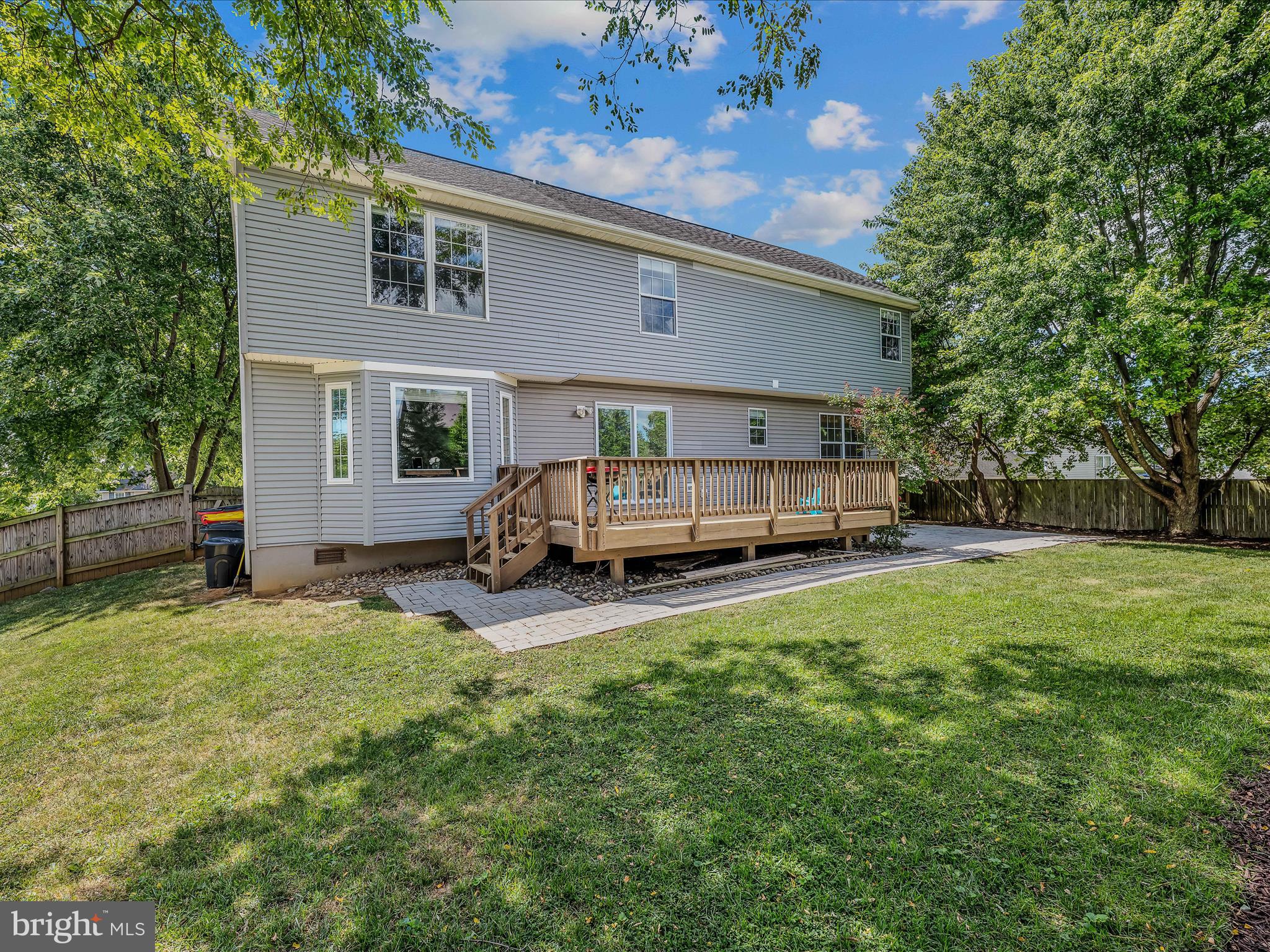 571 Oak Lee Drive Ranson, WV 25438 - Photo 30 of 45 a view of a backyard with a car parked in it