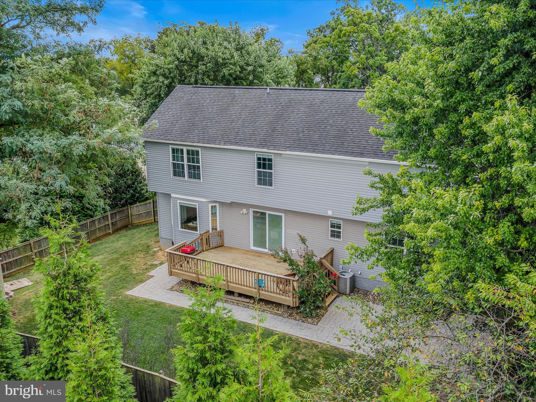 571 Oak Lee Drive Ranson, WV 25438 - Photo 32 of 45 an aerial view of a house with table and chairs under an umbrella