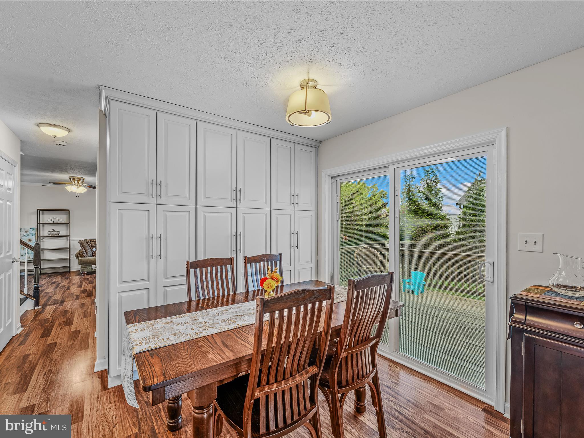 571 Oak Lee Drive Ranson, WV 25438 - Photo 6 of 45 a view of a dining room with furniture window and wooden floor