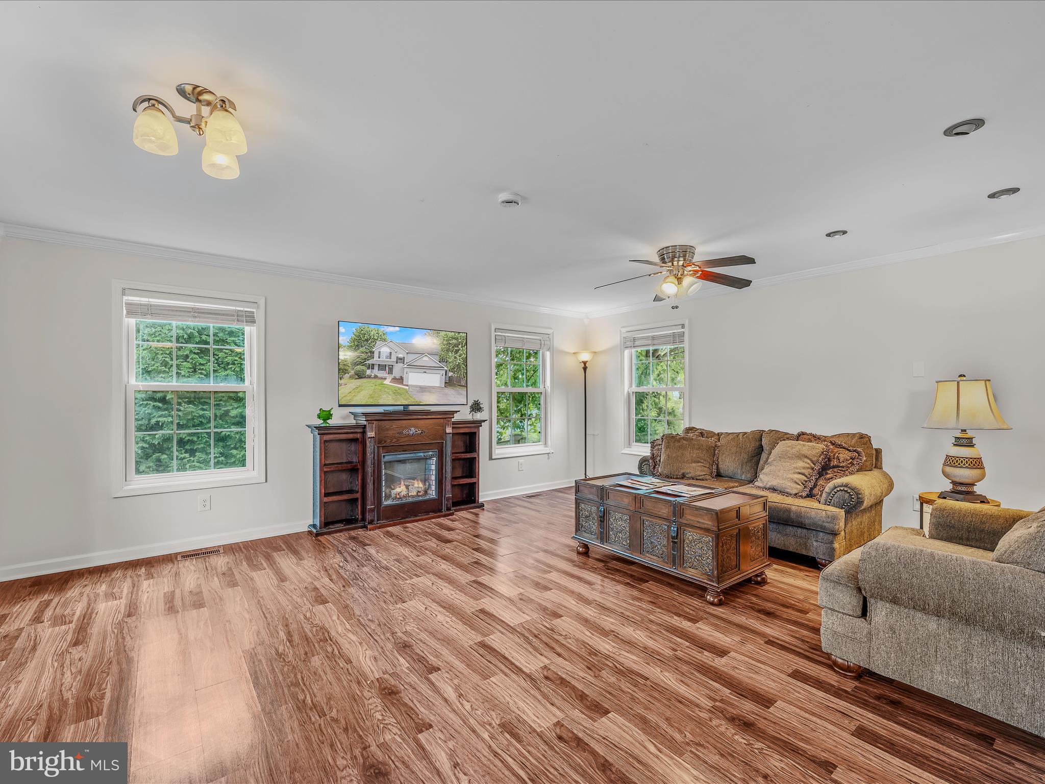 571 Oak Lee Drive Ranson, WV 25438 - Photo 8 of 45 a living room with furniture and a wooden floor